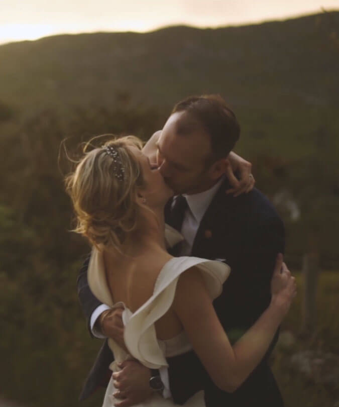 Bride and Groom Kissing in sunset